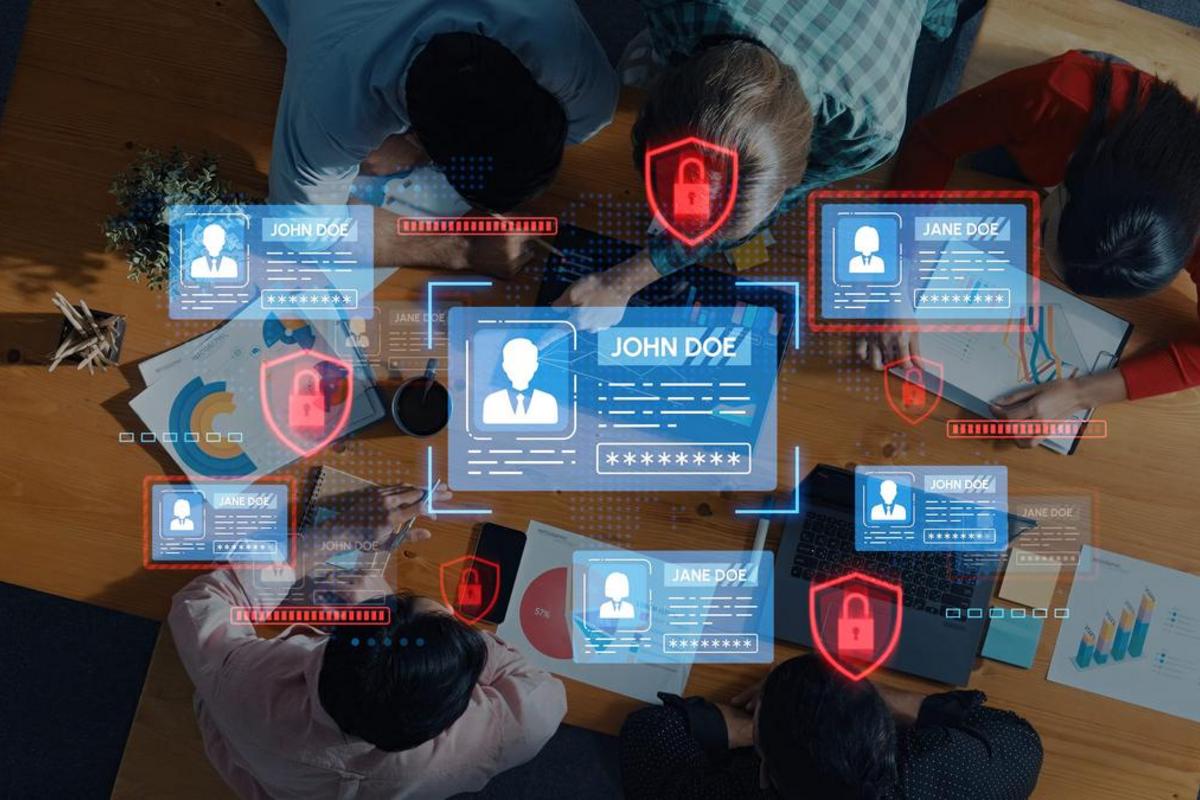 Team collaborating around a table with digital icons representing personal data, privacy, and security.