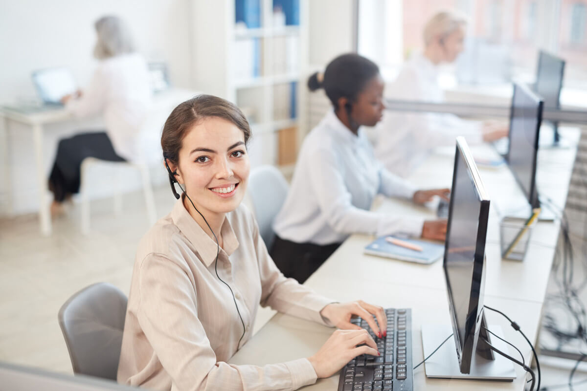 Woman with headphones working in Contact Center
